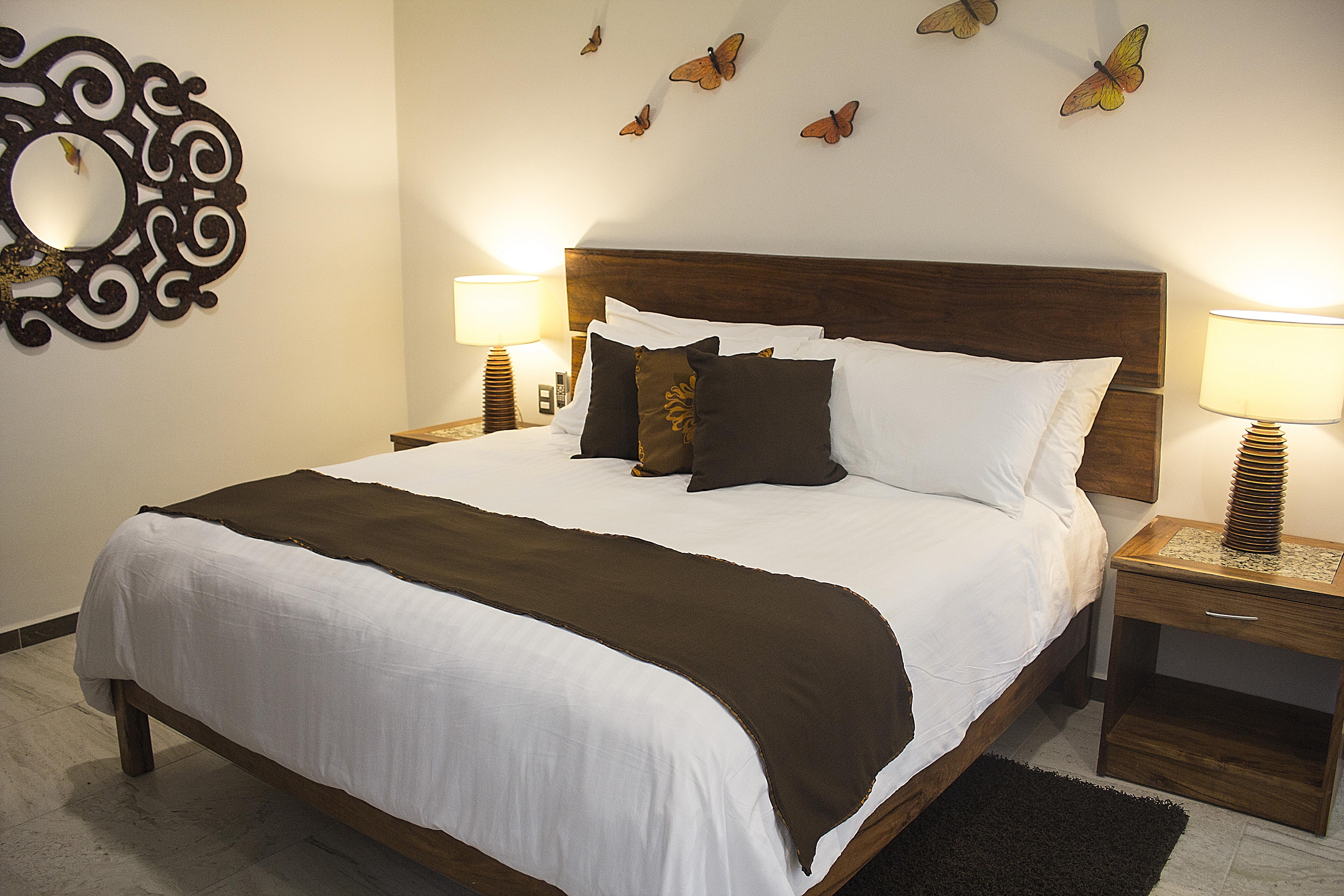 Casa Ticul Hotel Boutique - 5Th Ave (Adults Only) ปลายาเดลการ์เมน ภายนอก รูปภาพ A bed with a bed runner